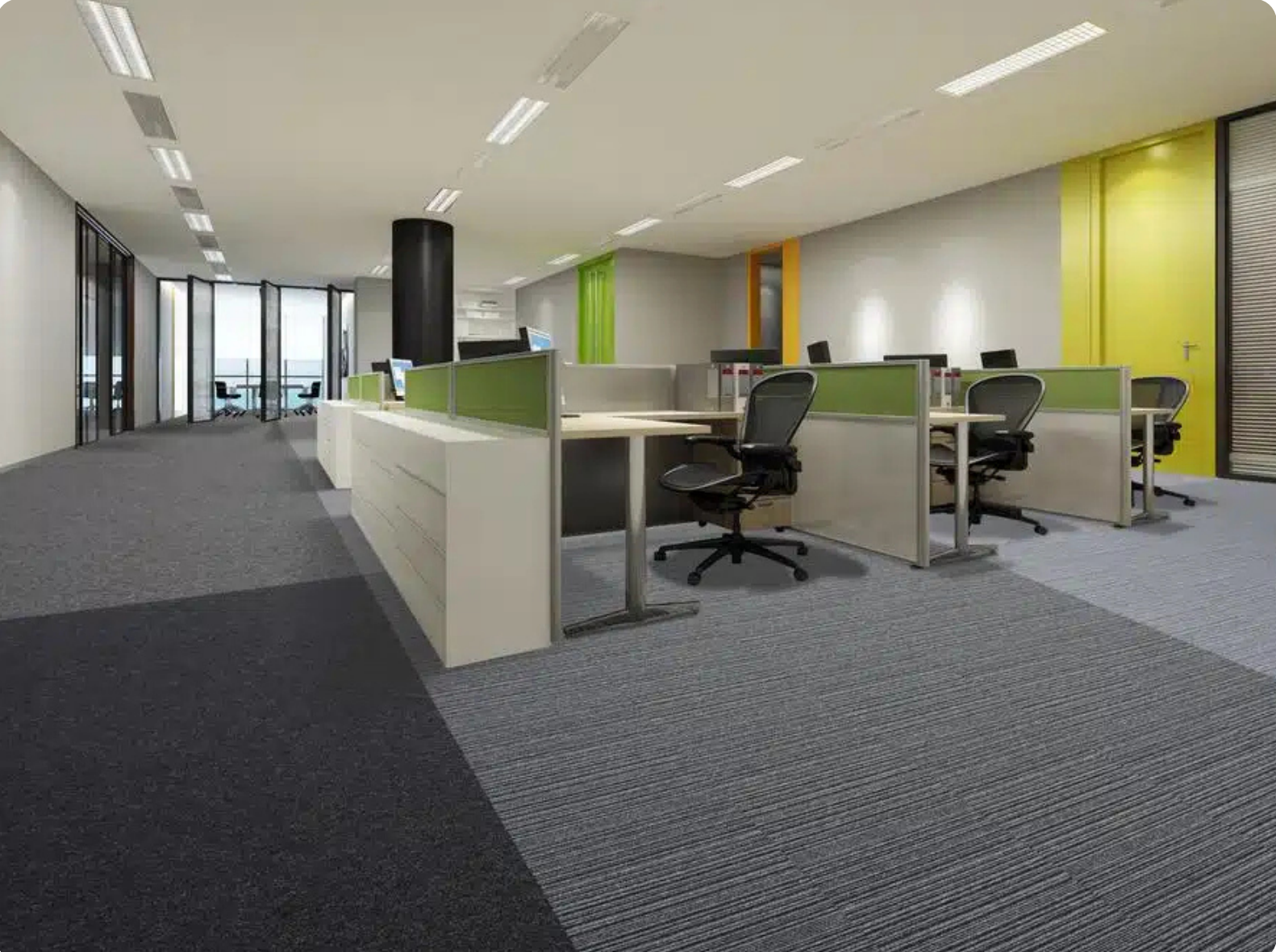 50x50 cm carpet tiles defining workstations in an open Dubai office
